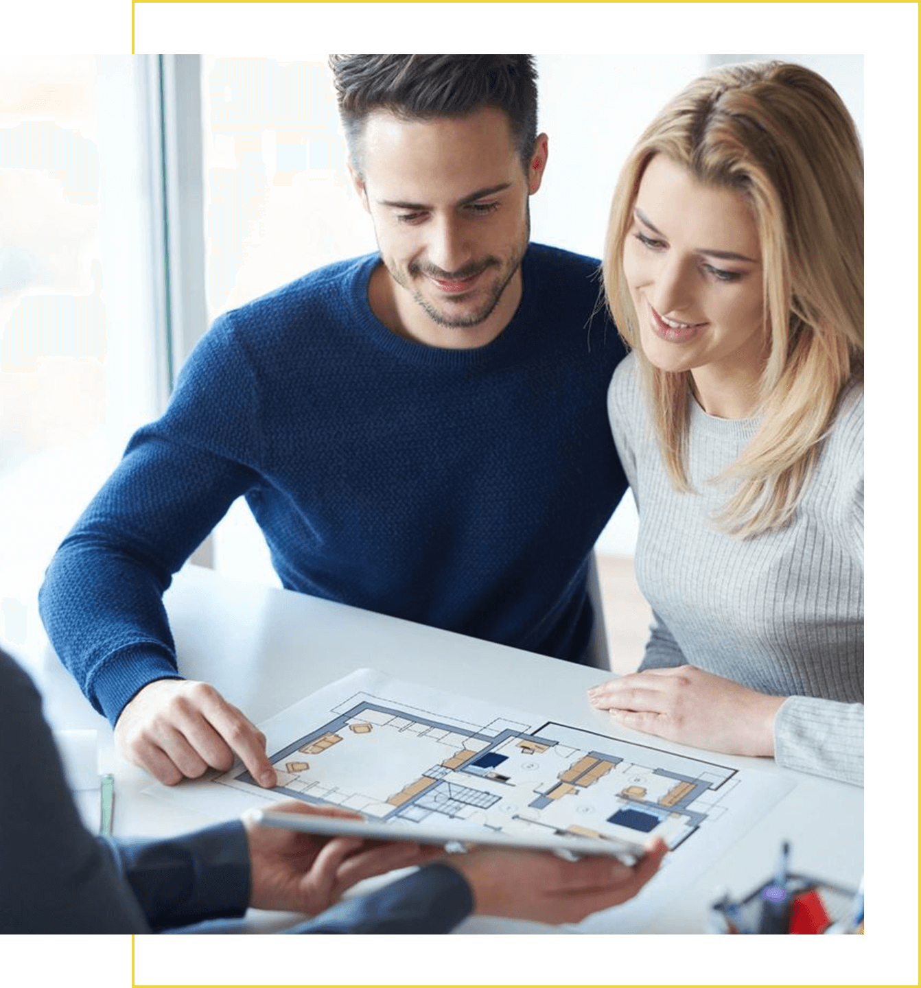 A man and woman looking at a board game.