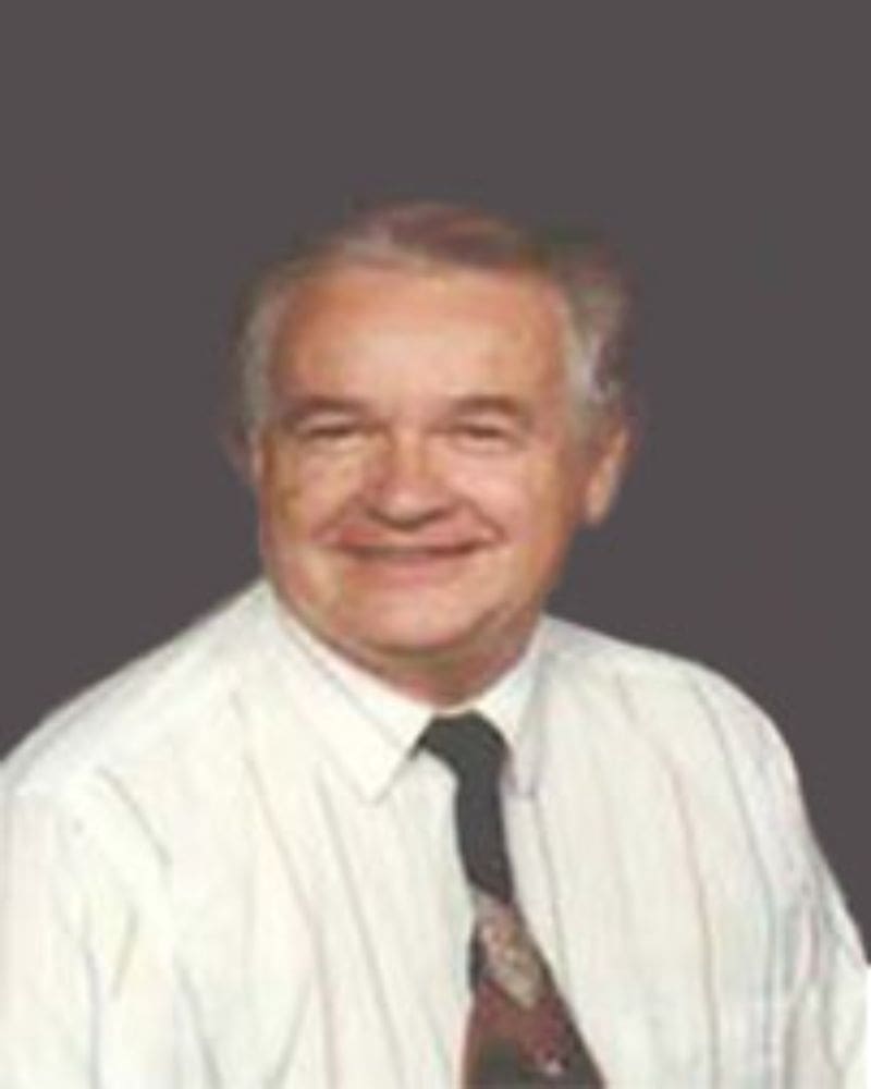 A man in a white shirt and tie.