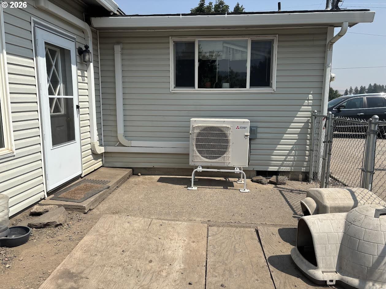 Exterior view of a house with air conditioner.