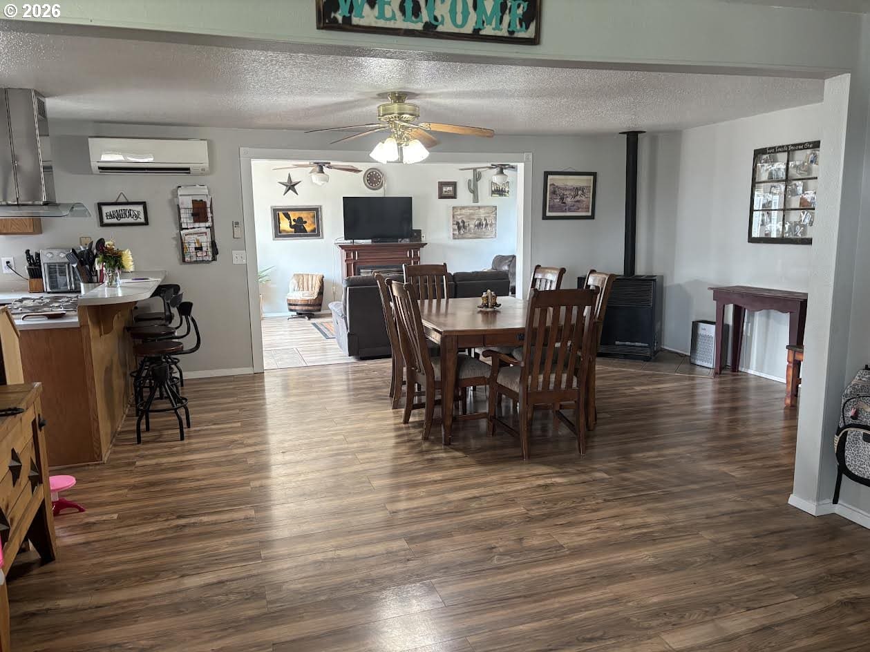 Open dining area with wooden table and chairs.