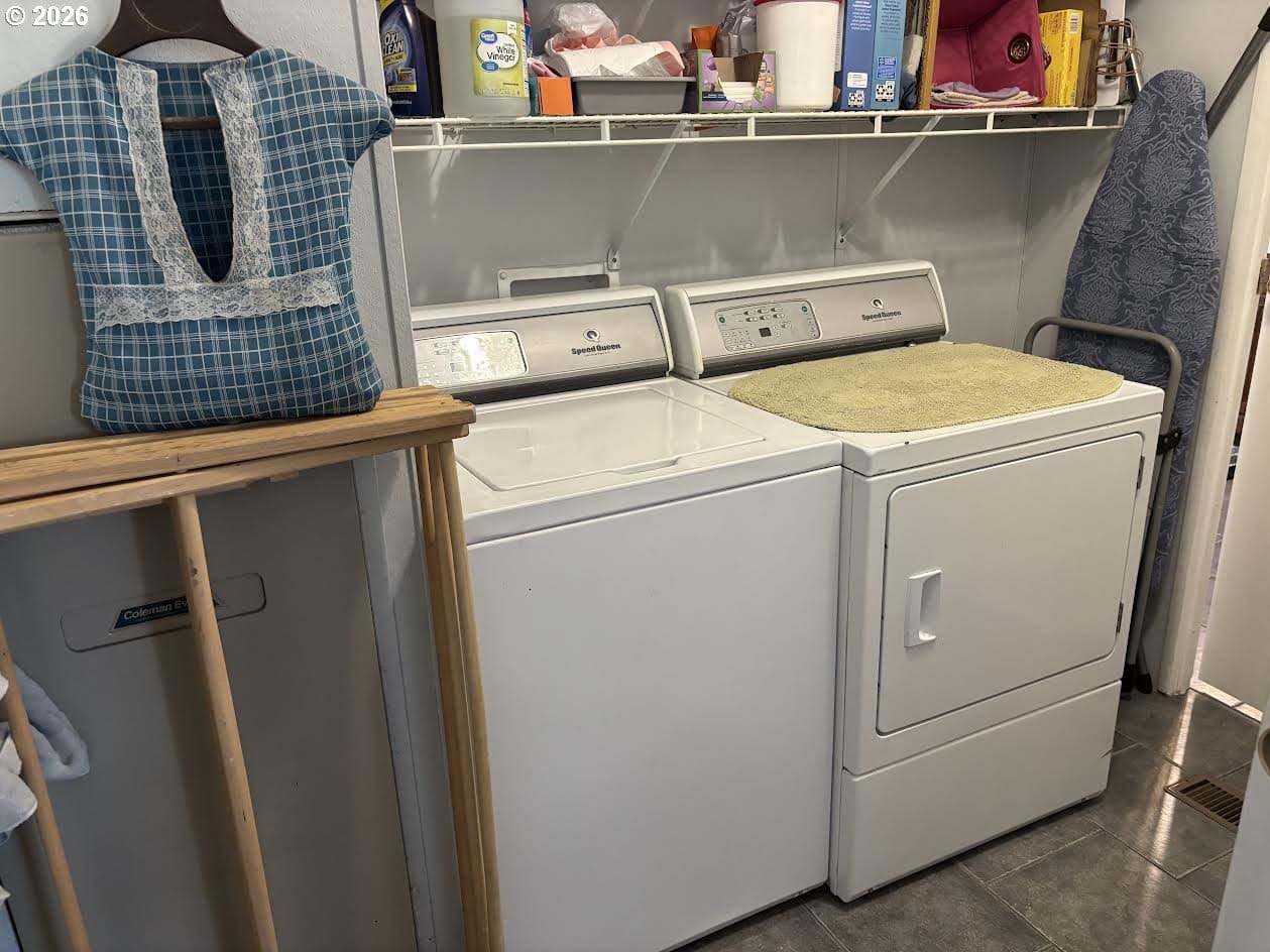 Laundry area with washer and dryer setup.
