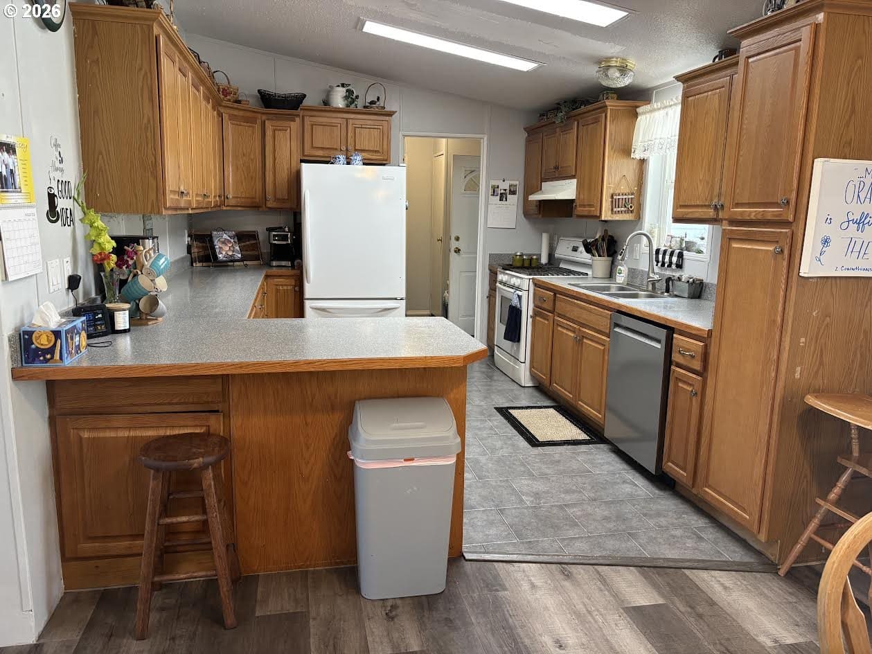 Cozy kitchen with wooden cabinets and countertop.