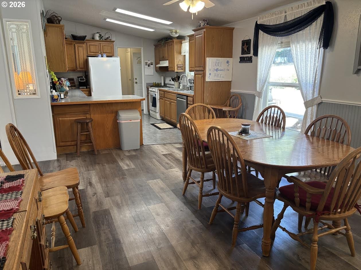 Cozy kitchen and dining area with wooden furniture.