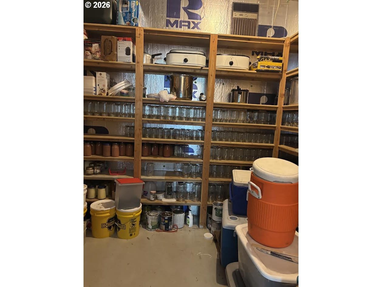 Storage room with shelves and containers.