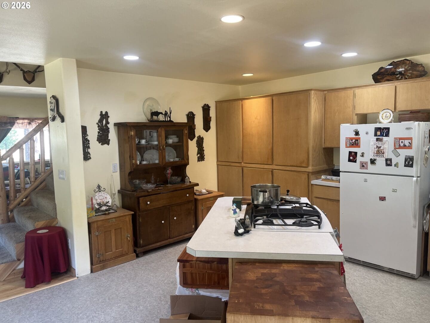 Cozy kitchen with wooden cabinets and decor.